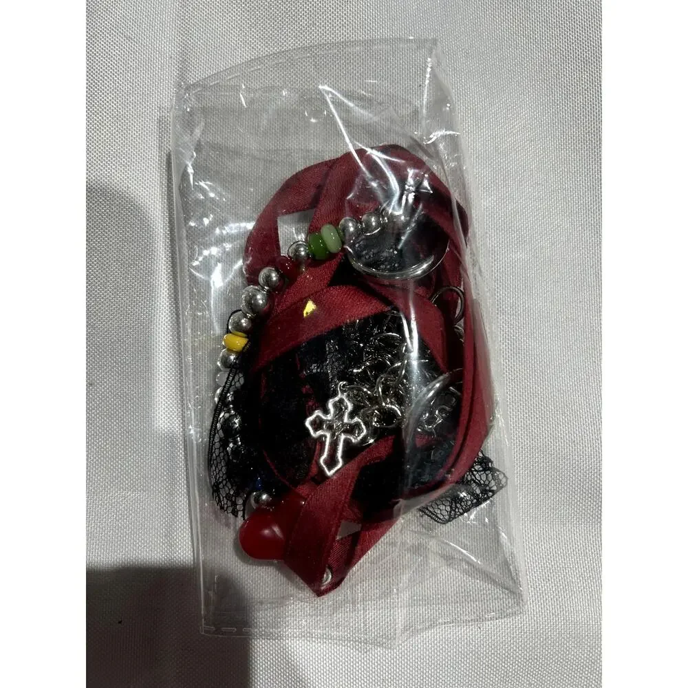 NWOT Deep Red Vegan Leather Handbag with Crossbody Strap and‎ Bag charms